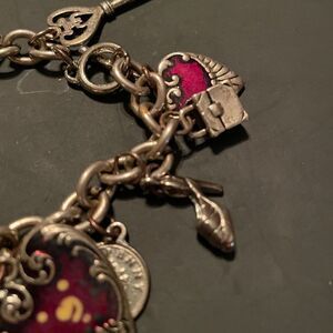 Silver tone Charm Bracelet with lots of Charms. So cute!